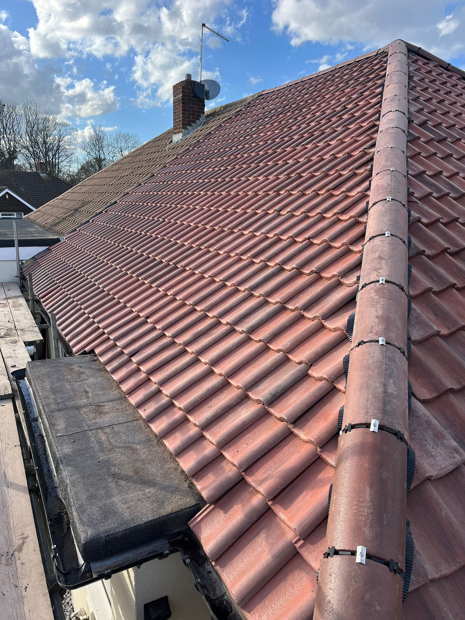 New clay tiled roof with dry ridge system New clay tiled roof with dry ridge system